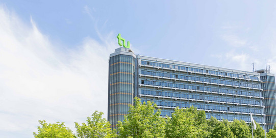 math tower building in the summer time with trees in front of it