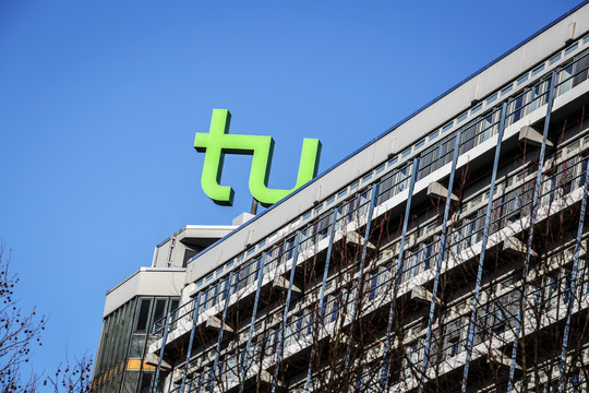 The picture shows the math tower with the logo of TU Dortmund University.