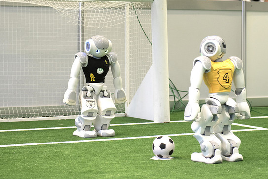 Two robots playing football (soccer)