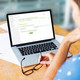 Woman sitting in front of her laptop