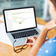 Woman sitting in front of her laptop