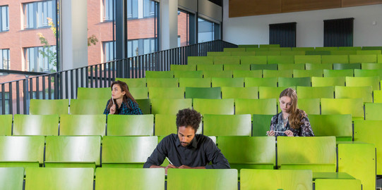 Students sitting in the seminar building