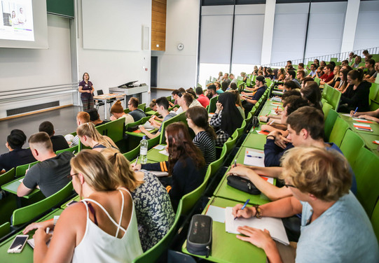 Students sit in a lecture at the beginning of the study.