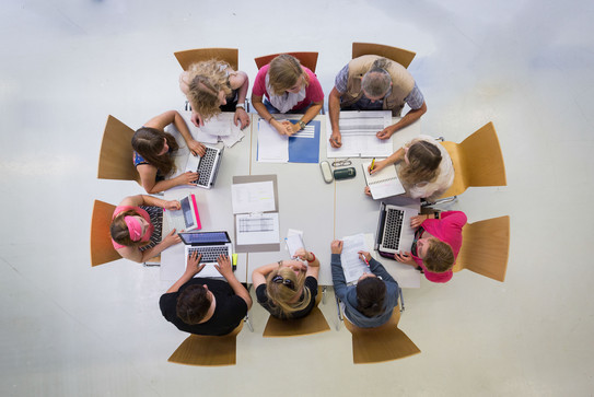 meeting situation 3 People sitting in a circle talking shot from above.