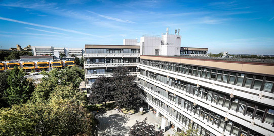 Aerial view of the large white Emil Figge 50 building