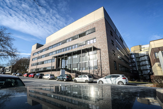 Building for Physics a modern grey-brown building with four floors