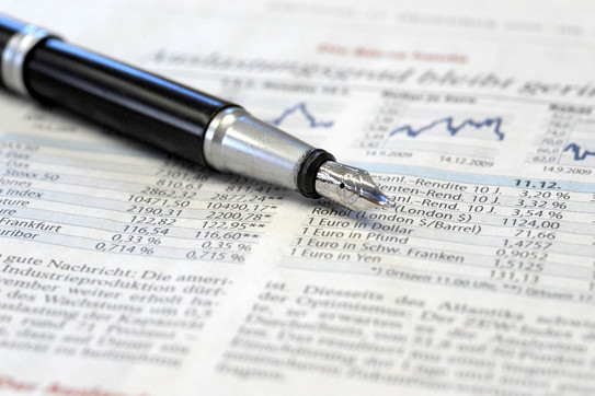 Newspaper with graphs and numbers of the stock market
